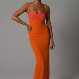Beautiful stretchy orange and pink dress. Fits a size 6-8